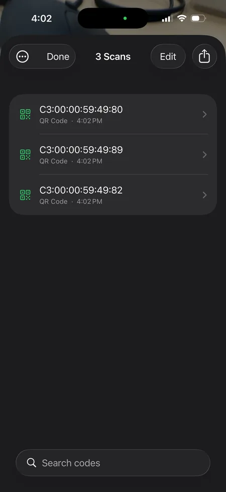 The review list showing three captured QR codes with their type and
                    scan time, above a search field.
